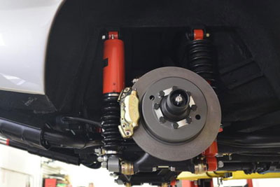 Rear suspension uses a traditional Koni coilover shock and a Koni load leveling unit in tandem (15491).