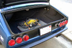 Tail lights in black panel, black bumper, and inside trunk (s/n 15499).